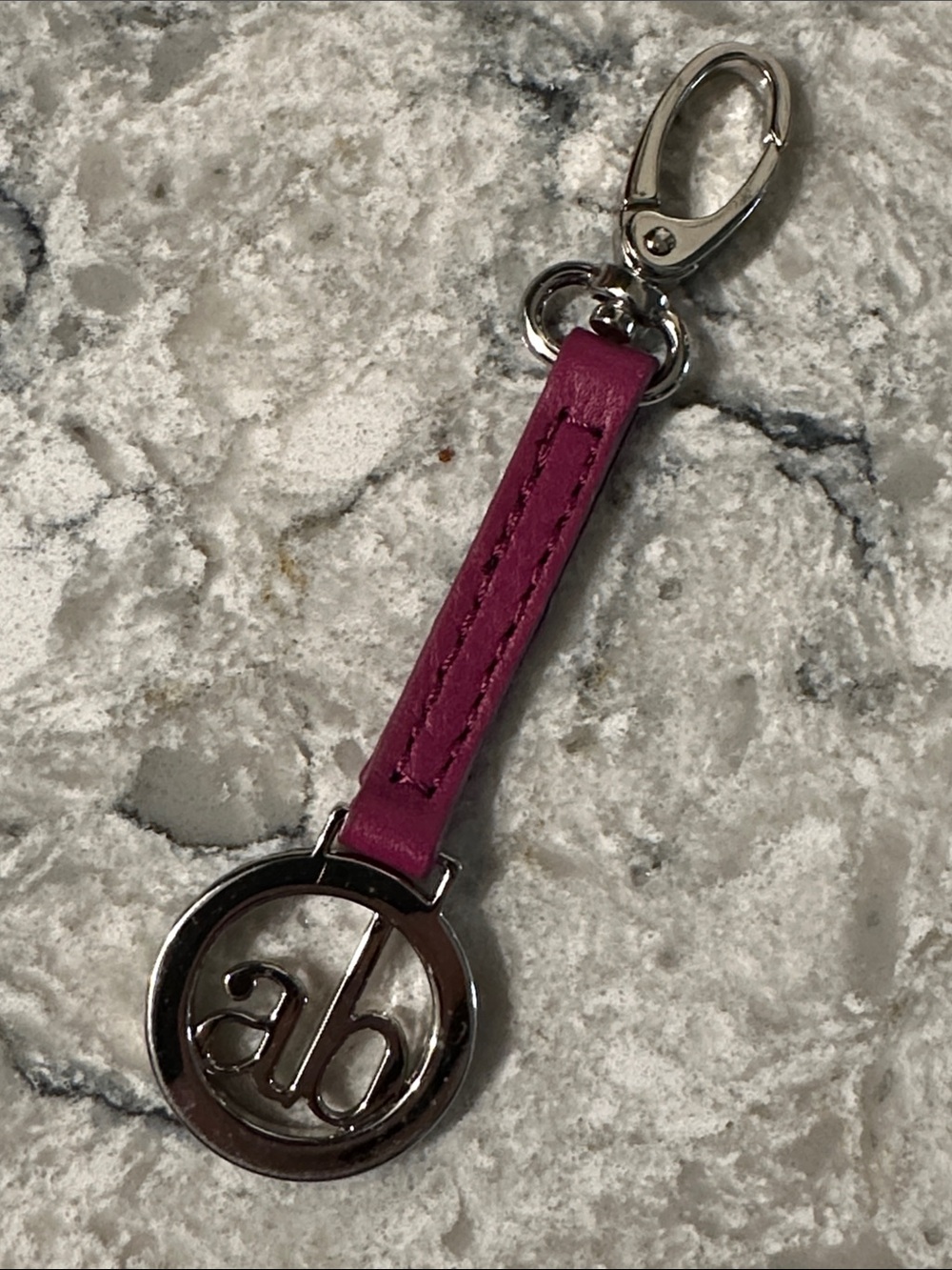 Audrey Brooke Purse Clip Hang Tag Leather Burgundy with silver metal medallion